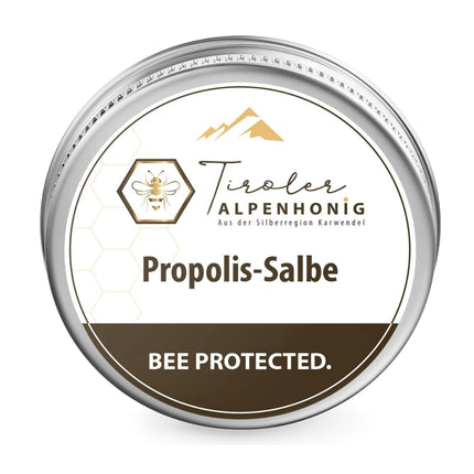 Propolisa ziede ar bišu vasku, olīveļļu, propolisa tinktūru un šī sviestu. Ziede (40 g) no Tiroles Alpu medus, kas ražots Tiroles kalnos.