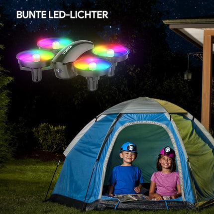 Mini drons ar kameru HD 1080P bērniem iesācējiem, TOMZON RC kvadrokopters ar krāsainām gaismas diodēm, ilgs lidojuma laiks, 360° propelleru aizsardzība/metiens/3D apgrieziens/, helikoptera tālvadības rotaļu drons iekštelpām